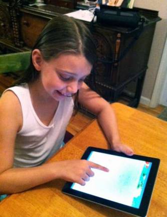 Warwick school host tech expo Oct. 29 Provided photo Kings fourth grade student Reiana Koulikov, 9, practices math facts on an iPad.