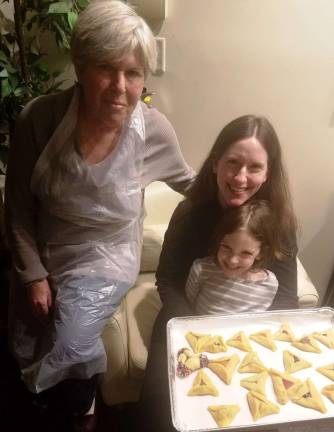 Chabad offers grand Superhero Purim Party on eb. 28 Three generations of Hamantash bakers: Sheryl Kerewski of Goshen, left, and her daughter Michelle Sentell and granddaughter Heather of Monroe proudly display their hamantashen at a Chabad workshop.