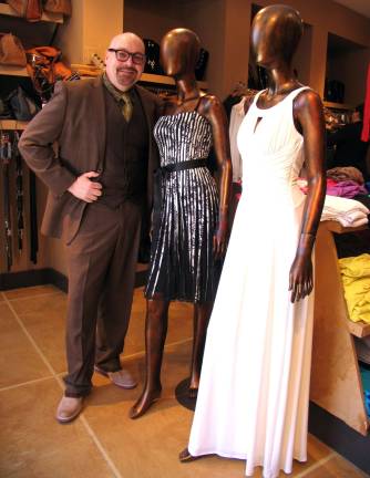 Alternative prom dresses at Style Counsel Photo by Roger Gavan Tim Mullally, co-owner of Style Counsel, offers a selection of different gowns for this yearþÄôs prom season.