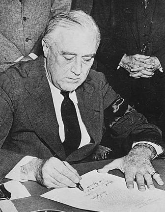 'December 7th, 1941 - a date which will live in infamy' Source: National ArchivesPresident Franklin Roosevelt signing the Declaration of War against Japan, December 9, 1941.