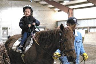 Golden Hill students get a first-hand look at how to ride and care for horses.
