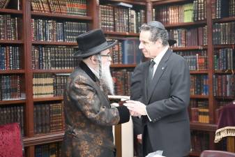 Rabbi Chaim Rottenberg with Gov. Andrew Cuomo the day after the stabbing attack at the rabbi's home.