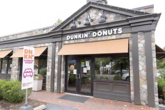 Last Thursday, Sept. 23, photographer Robert G. Breese was among the regular customers who discovered that Dunkin’ Donuts along Main Street in Warwick was temporarily closed according to the sign he saw posted on the front door. Photo by Robert G. Breese.
