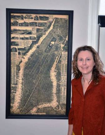 Warwick resident's blog featured in Newsweek article Peggy Gavan poses with her favorite map, the 1879 Galt-Hoy map of New York City purchased at Frazzleberries.