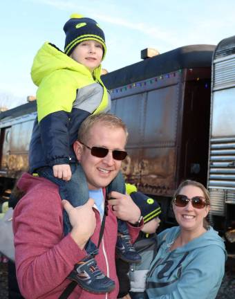 Robert and Nicole Crispell with their children Bryce, 3, and Grant, 1, were among those enjoying the arrival of the train.