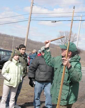 A spear-throwing demonstration during a past tour of Dutchess Quarry Caves. In the 1960s, archaeologists found a fluted point, a very rare stone tool used for hunting, among the artifacts left by hunter-gatherers during the last Ice Age.