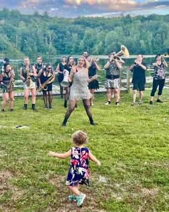 Dancing with Funkrust Brass Band at Fuller Moon Arts Festival. Photo by Hannelore Chambers.