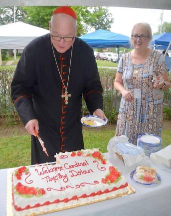 Following the well-attended Mass, a reception under a large tent on the front lawn of the church was held during which the cardinal met with all of those who attended.