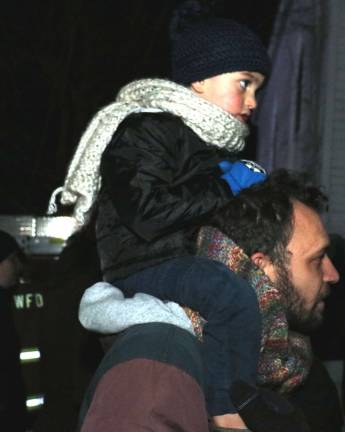 Record crowd at Warwick's Christmas Tree lighting and early Santa visit Teo, 2, has the best seat in the house on the shoulders of his father, Joshua Meci.