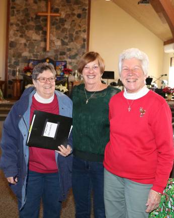 Warwick Ecumenical Food Pantry distributes more than 200 Christmas food baskets They help make it happen.From left, Carol Meyer, Holiday Basket Director Marge Koopman and Regina Foley, who with Meyer's help, coordinates the distribution to senior residents and sends out thank you notes to the donors.