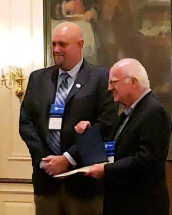 Dr. Richard Hull of Warwick was recently honored by the Association of Public Historians of New York State with the annual Franklin D. Roosevelt Local Government Historian Award for Lifetime Achievement for his many publications, lectures and thousands of hours of volunteer service devoted to protection of and education about Warwick and Orange County historical heritage. Pictured left to right: New York State Historian Devin Lander and Dr. Richard Hull