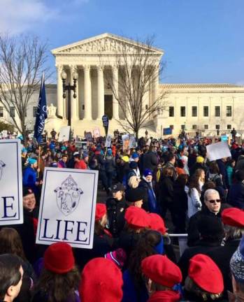 Warwick resident and college student reports on March for Life Provided photo The Most Rev. Edward B. Scharfenberger,the Bishop of Albany, (lower right wearing dark glasses) leads a group in praying the rosary at the 46th annual March for Life.