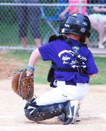 All Stars and ball players, no matter how young Catcher Jack Vander Plaat checks the signs with his manager before he frames up strike three.