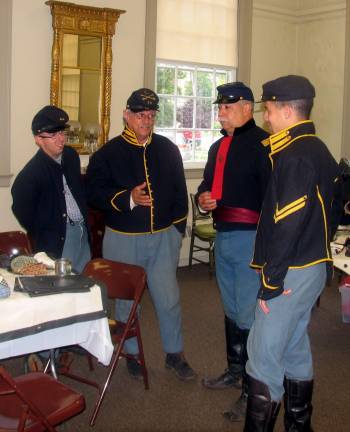 George Washington Day Picnic held indoors Photo by Roger Gavan When heavy rains and the threat of thunderstorms canceled outdoor activities last Saturday, members of the 15th New York Volunteer Cavalry were able to set up a static Civil War-era display in the AW Buckbee Center, headquarters of the Historical Society of the Town of Warwick. Pictured from left are: Zak Szakmary, Don Levesque, Capt. Ken Colomba and his son Kevin.