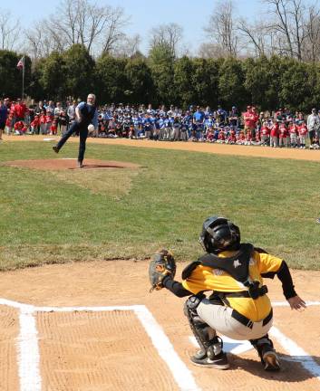 Playball Mayor Newhard threw out the first baseball to catcher Justin Acosta,