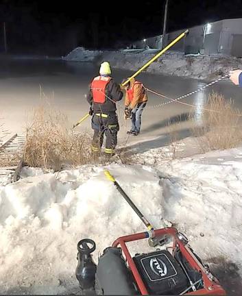 Warwick. Fighting fires when it’s cold, there are no hydrants and water is hard to find Warwick Fire Department Lt. Kevin Hughes is tendered on shore while Capt. Kelly Brock cuts a hole in the ice with a saw to draft water from the ice-covered pond off Kavalec Lane during a recent drill.