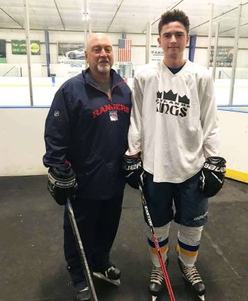 Warwick Washingtonville Ice Hockey Club players take spotlight in games Photo Credit: WIHC Board Assistant Varsity Coach Bob Eisenhauer with Jacob Branch.