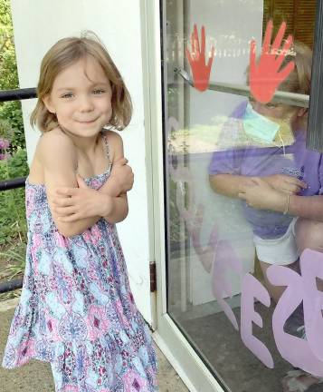 Penelope Lopez of Warwick loves St. Stephen Mini Me Childcare at St. Stephen’s Church with MaryJane Undersinger (inside door) who has 32 years’ experience in childcare. Provided photo.