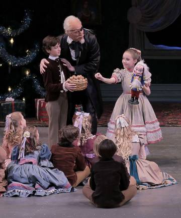 Local to dance in NYC Credit Photo: Paul Kolnik Shown is the party scene from George Balanchine's The Nutcracker from last year. Pierson will be a guest in the party scene during this year's performances. From left to right: Robert La Fosse as Herr Drosselmeier, Colby Clark as his Nephew and Fiona Brennan as Marie