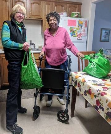 A little bit goes a long way, thanks to the Friendly Visitors Provided photo Friendly Visitor Program Volunteer Kris Korn and neighbor Ruth Askew take a break from their groceries chore to pose for this picture. Ruth is very grateful for the help Kris provides to help her maintain her own home. Kris is happy to volunteer in her home town.