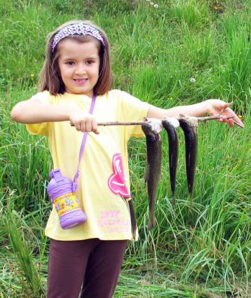 Take a Kid Fishing by the numbers: 400 trout; 150 kids; everyone a winner Photos by Roger Gavan Samantha Brady, 6, shows that girls make pretty good "fishermen."