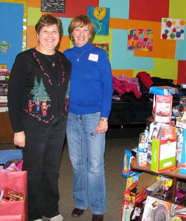 250 Christmas food baskets delivered In a program at the Church, managed by Debbie Moran, affectionately known as ìThe Toy Lady,î needy families who came to pick up their Christmas Food Baskets, also have an opportunity to select a free toy or purchase a more expensive one for a token sum of one dollar. From left, Debbie Moran and Christmas basket distribution Chairperson Marge Koopman.