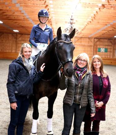 Olympian Dressage rider conducts symposium at Raven Hill Farms Photos by Roger Gavan On Friday and Saturday, Oct. 12 and 13, Raven Hill Farms in the Village of Florida, welcomed Laura Graves, the number one ranked dressage rider in the world, to conduct a symposium for professional riders. From left, Laura Graves, gold medal rider Molly Maloney atop Jhett, Raven Farms owner Deirdre Hamling and Molly Maloney's mother, Jennifer Malloney.
