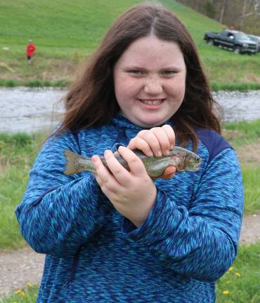Come fish, go fish Samantha Kelly, 10, was all smiles when she caught this Rainbow Trout.