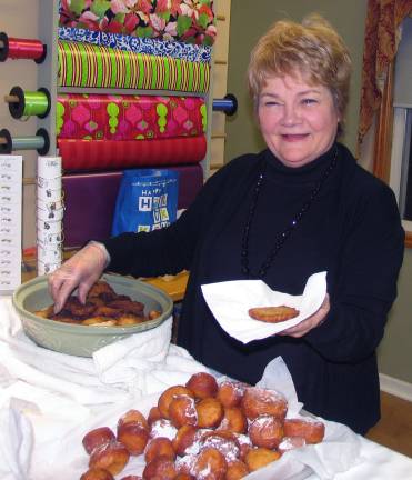 Warwick residents celebrate Hanukkah at 20th anniversary of Warwick Menorah lighting Photos by Roger Gavan The crowd then headed down Main Street to Forever Jewelers where they were served traditional latkes prepared by Doris Schwartzberg.