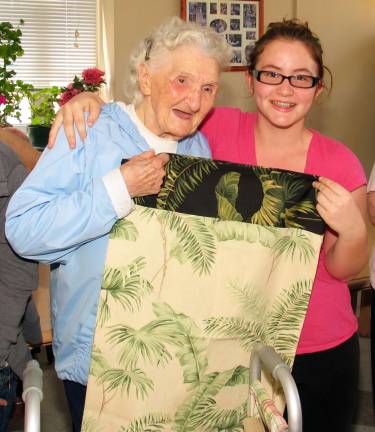 Middle School students present handmade pillow cases to Mount Alverno residents Mount Alverno resident Louise Contento shares a happy moment with Nicole Ramirez who presented her with a handcrafted pillowcase.