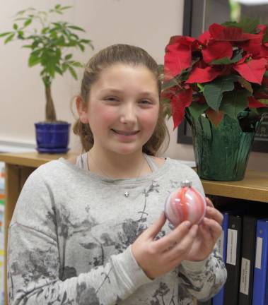 Trying to make a difference, one ornament at a time Provided photo Jillian Disy and her com created more than 100 ornaments, that sold at the Middle School PTA Craft Fair. She raised $375, money which she donated to the Backpack Snack Attack program.