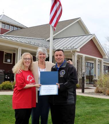 Melinda's Music recognized by State Assembly as asset to community Photo by Roger Gavan Melinda's Music was recently recognized by the New York State Assembly as an asset to our local community. Founder Melinda Burgard (left) accepts the award from Assemblyman Karl Brabenec as Albert Wisner Public Library Director Rosemary Cooper (center) joins in the ceremony.