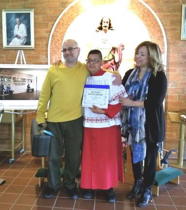 Danny Battista Memorial Trumpet Scholarship winner announced Photo by Terry Gavan After Mass, everyone gathered in the atrium of the church as Rocco and Judy Battista presented the Danny Battista Trumpet Scholarship to Fernando Alquezada, who was also an altar server at the celebration.