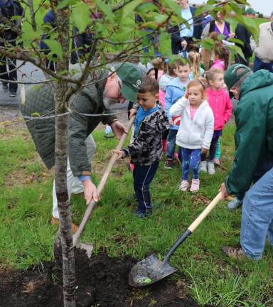 Plant a tree, hug a tree The pre-K class was invited to line up and help plant the new Oksame Cheery Tree.