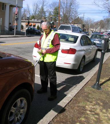 Village of Warwick hires parking enforcement officers Photo by Roger Gavan Parking Enforcement Officer John Leardini, pictured here, and Christopher DiMauro, will begin issuing parking tickets this Friday, March 18.