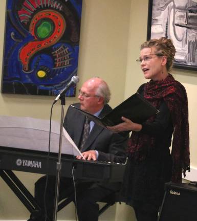 Albert Wisner Public Library hosts Remembering the Armistice Jody Weatherstone, accompanied by Dennis English, gave a beautiful rendition of the World War I era song, "In the Shade of the old Apple Tree."
