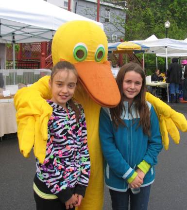 Warwick’s 23rd annual Duck Derby held Sunday, May 19 The Winslow Duck was on hand at the Farmers' Market to sell a few more tickets and pose for photos with children like (from left) Ali Robertson, 10, and Morgan Pietrzak, 10.