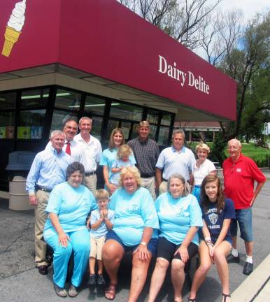 Dairy Delite celebrates 25th anniversary Photo by Roger Gavan On Friday, July 27, local officials and representatives of the Village of Florida and the Florida Chamber of Commerce joined owner Dorothy ìDottieî Ehlers, members of her family, her staff and others to celebrate the 25th anniversary of Dairy Delite. Seated from left are: employee Marie Heter; Vincent Ehlers, 3; owner Dorothy ìDottieî Ehlers; employee Denise Thibault; and Emily Cady, granddaughter of Village Trustee Brian Slattery. Standing from left are: Jim Mezzetti, president of the Florida Chamber of Commerce; Town of Warwick Deputy Supervisor James Gerstner,;Village of Florida Trustee Brian Slattery; Michelle and Glenn Ehlers, assistant building inspector, with their daughter Brooke, 3; property owners Jeff Rosenberg and Robin Cohen; and Village of Florida Historian J.R. Pillmeier. Owners Chuck and Eric Ehlers were not present for the photograph.