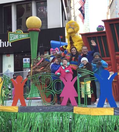 Young Warwick actress performs at Macy's Thanksgiving Day parade Provided photo Violet Tinnirello (center front with red coat) performs on the Sesame Street float in the Macy's Thanksgiving Day parade.