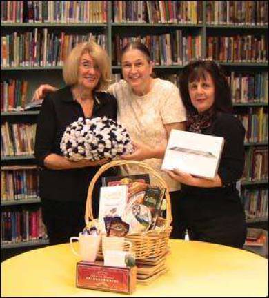 Library volunteers preparing for holiday raffle and sale Library volunteers preparing for holiday raffle and sale