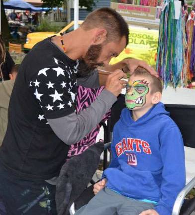 Applefest 2016 draws large crowds despite light rain and cooler weather Former Warwick resident Luke Schaffer, 9, now of Lord's Valley, Pennsylvania, has his face painted as a monster.