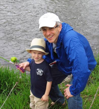 Take a Kid Fishing by the numbers: 400 trout; 150 kids; everyone a winner Larry Polsky and his son Zach, 3.