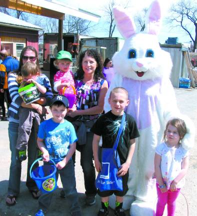 The great egg hunt at Pennings Farm always draws a crowd During the event, the Easter Bunny was also on hand to pose for photos with the children. Rear from left, Marie Moore holding her son Nate, 3;and her mother-in-law, Ann Marie Moore, holding her granddaughter Sember Moore, 2. Front from left, Gavin Moore, 5, Griffin Petzold, 7 and his sister Mya, 3.