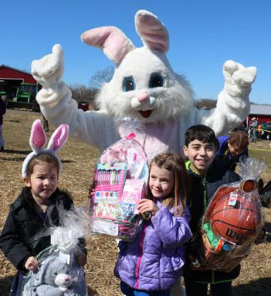The hunt, part two The children also hunted for special “golden eggs.” Each one of these contained notes entitling the lucky child to a special Easter basket.The lucky winners were from left, Madelyn Hoffman, 4, Ramona Uschnig, 5, and Anthony Mazza, 11.