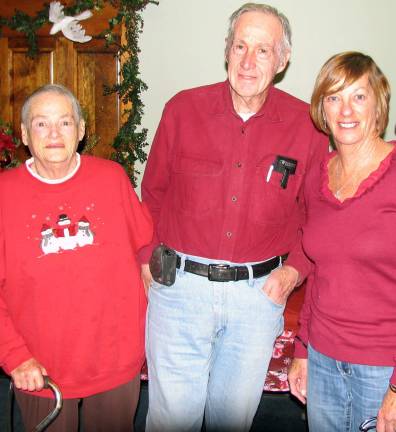 Warwick Ecumenical Council distributes 260 Christmas food baskets From left, Food Pantry director Michele Carter, Rev. Richard Ryley and Chairperson Marge Koopman.