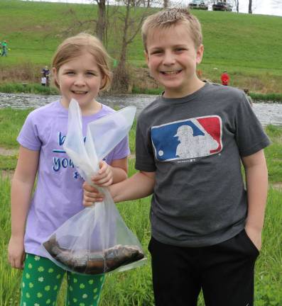Come fish, go fish Kathleen Baird, 10, and her brother Robert, 12, each caught a trout. Their Great Grandfather Bill Baird, 99, is also the original owner of the farm and he will celebrate his 100th birthday this August..