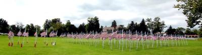 Thirteen flags (far left), representing the service men and woman who died during the recent Afghanistan evacuation, were among 233 flags to honor the heroes of Warwick and beyond that were on display during the Warwick Rotary Club’s Flags for Heroes. Photo by Roger Gavan.