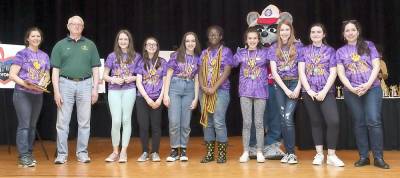 Warwick Valley Middle School's Longshot Solution Division 2 team wins first place. Pictured from left to right are: Coach Donna Denny, Jeff Carter of NYSOMA, Sophie Cresser, Ava Gell, Juliana Woods, Kooki Aryeetey, Alexa Keys, Olivia Holland, Talia Hartigan and Coach Rekha Woods.