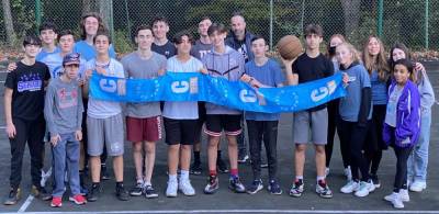 Teens from across Orange County participated in the CTeen Charity Basketball Game. Pictured with the teens is Russel Cohen of Highland Mills, who was the referee, and Chana Burston, co-director of Chabad. Photos provided by Chabad of Orange County.