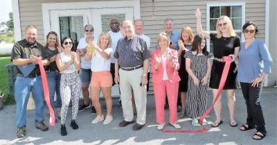 Pictured from left to right at the grand opening of Wildfire Wellness yoga center in Pine Island on Saturday, Sept. 18, are: Paul Ruszkiewicz, Orange County Legislator; Eva Gaspari; Mariah Lynn; Katherine Tripp; owner Therese Civitello; Earl Tripp; Warwick Town Councilman Floyd DeAngelo; Paul Civitello; Warwick Town Justice Nancy DeAngelo; Mark and Patti Damia; April McCosker; Susan McCosker, president Pine Island Chamber; and Janet Zimmerman, vice president Pine Island Chamber. Provided photo.